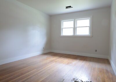 Empty room with newly finished wood flooring