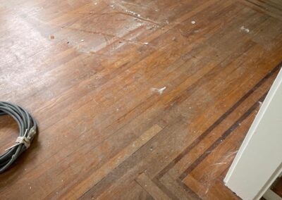 Herringbone hardwood floor laid in a hallway