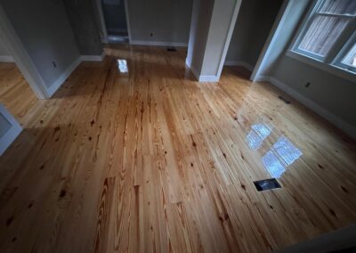 Refinished pine floor with visible grain and knots