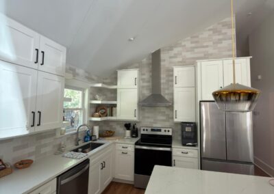 Open-plan kitchen and living space with continuous wood flooring