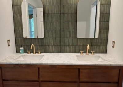 Double vanity above a patterned tile bathroom floor