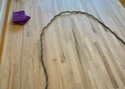 Freshly coated hardwood floor with a wet finish still curing